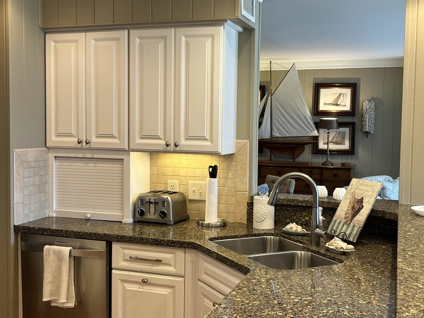 Discover the epitome of coastal elegance at 103 Inlet Point - photo 25