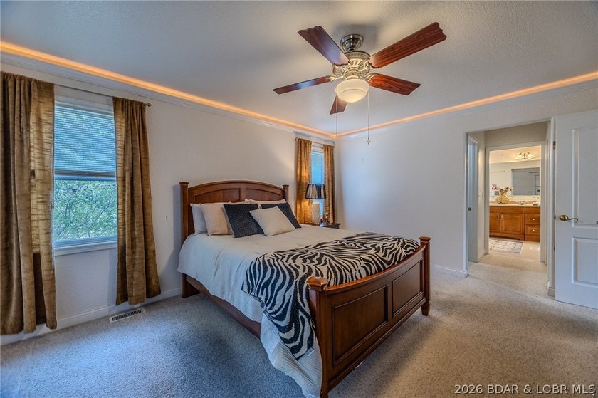 Welcome to this 4-bedroom, 3-bath lake-area-retreat with - photo 15