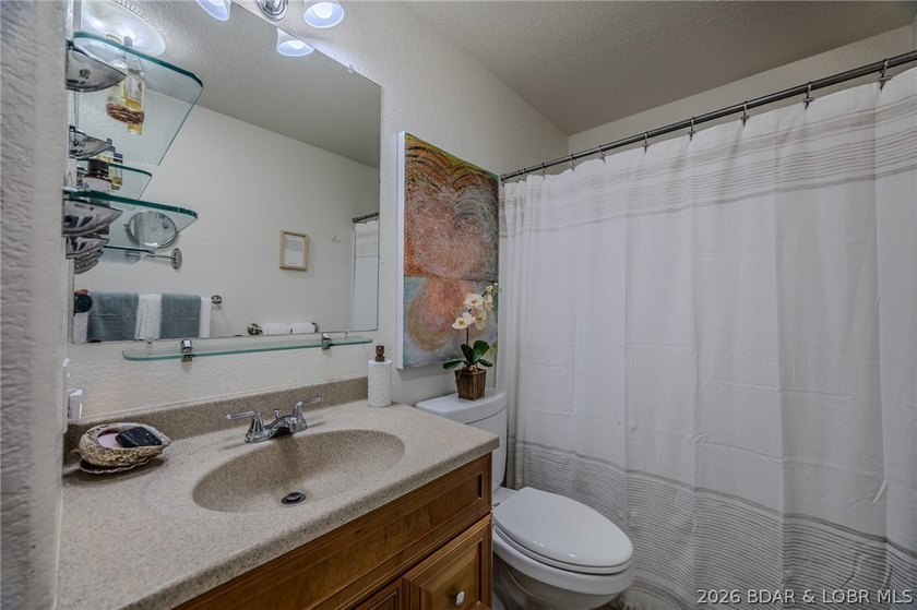 Welcome to this 4-bedroom, 3-bath lake-area-retreat with - photo 22