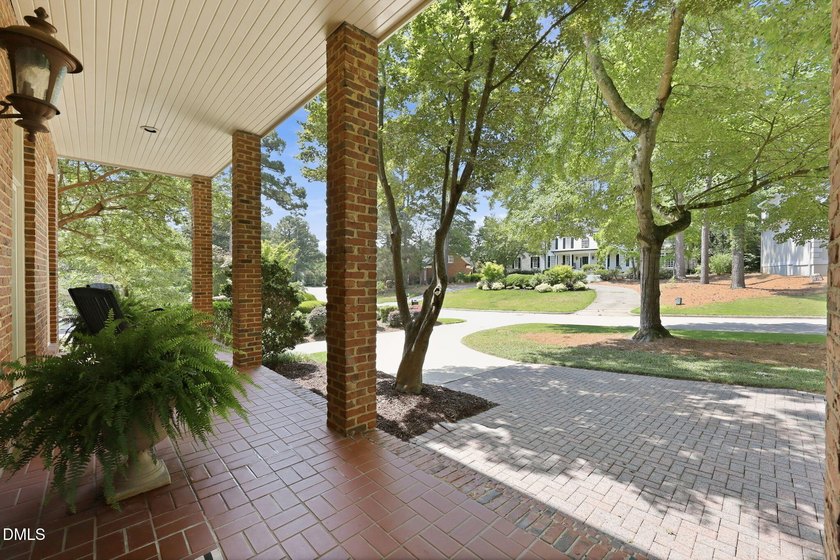 Quietly tucked away in North Ridge, this custom estate captures - photo 9