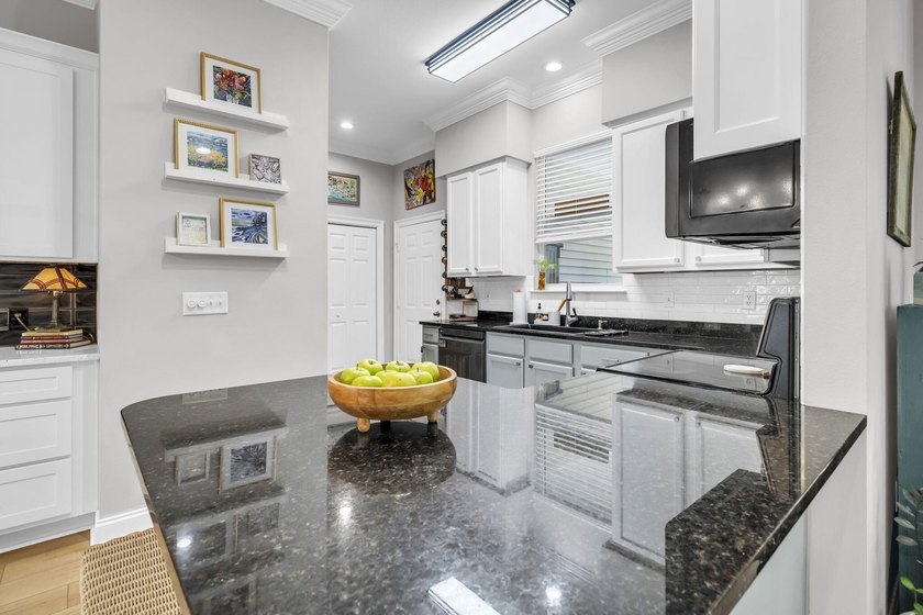 Welcome to 65 Courtyard Circle, where coastal living meets - photo 16