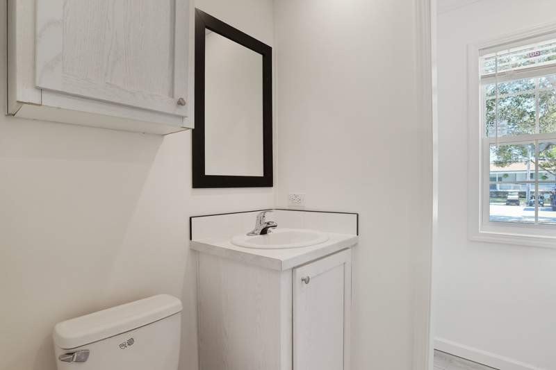 This cozy manufactured home in Tropical Haven offers 2 bedrooms - photo 12