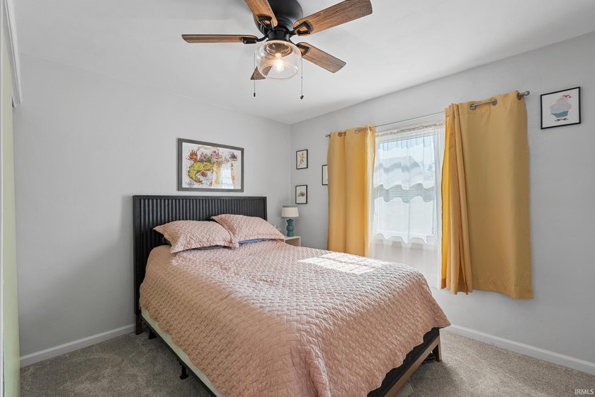 Tucked into a peaceful setting with mature trees and open green - photo 25