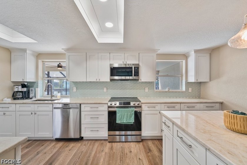 Welcome to 5400 Almar Drive, a rare waterfront gem situated on a - photo 13