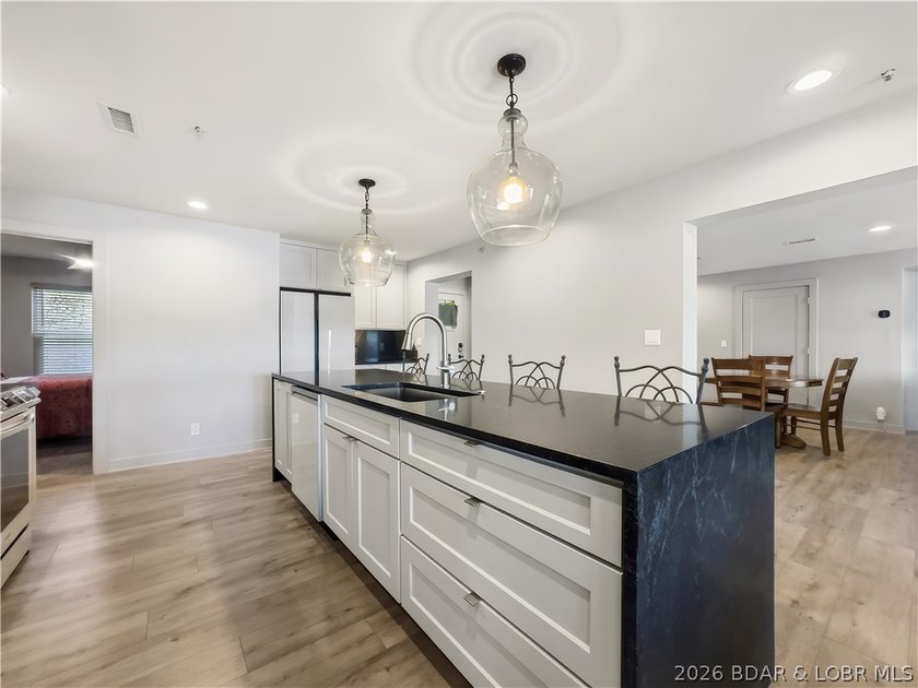 Turnkey luxury and breathtaking lakefront views await in this - photo 14