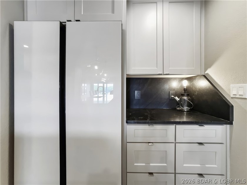 Turnkey luxury and breathtaking lakefront views await in this - photo 15
