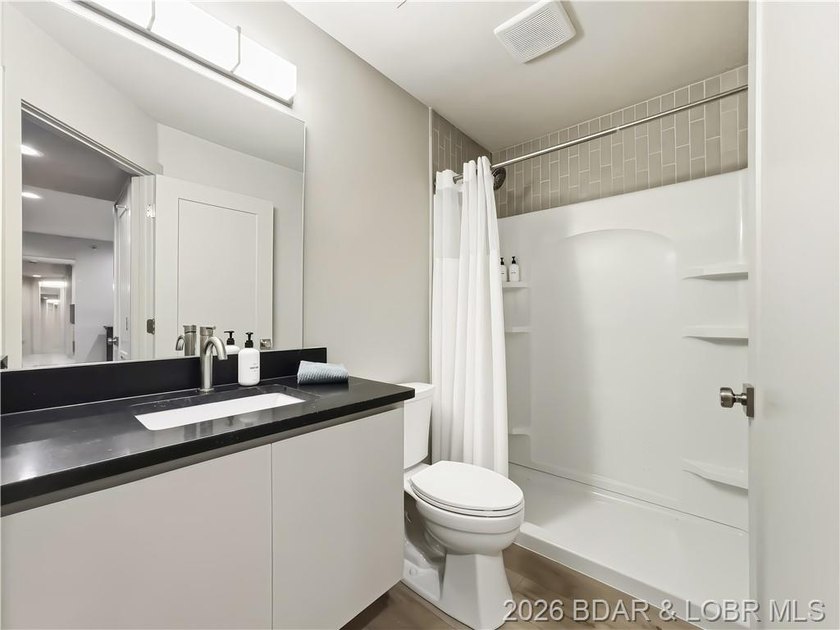 Turnkey luxury and breathtaking lakefront views await in this - photo 37