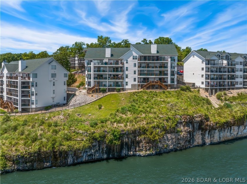 Turnkey luxury and breathtaking lakefront views await in this - photo 50