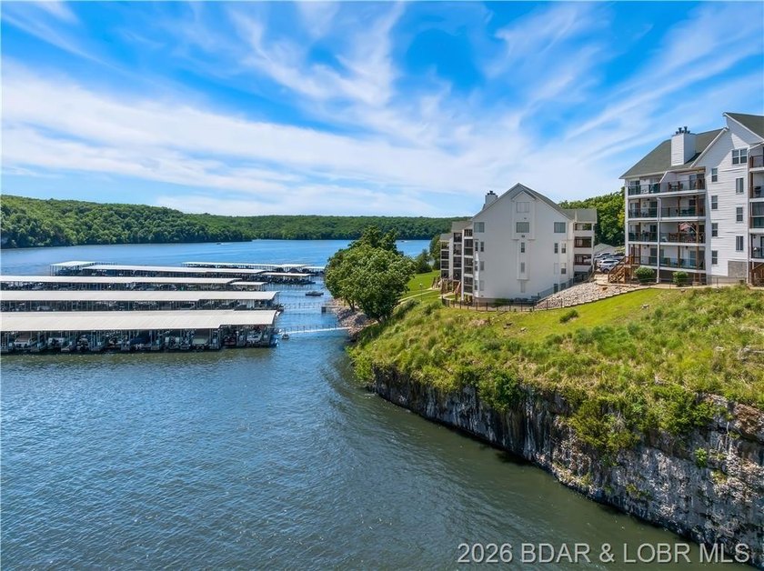 Turnkey luxury and breathtaking lakefront views await in this - photo 52