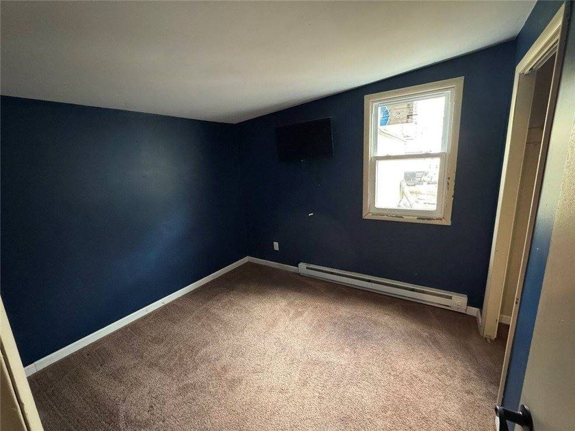 Welcome to this charming ranch-style home in Oswego, NY, ideally - photo 17