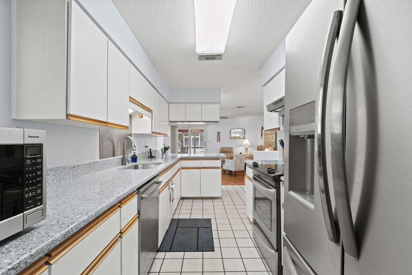 Ultimate Coastal Oasis: 4BR Home on Rare .553 Acre with Private - photo 16