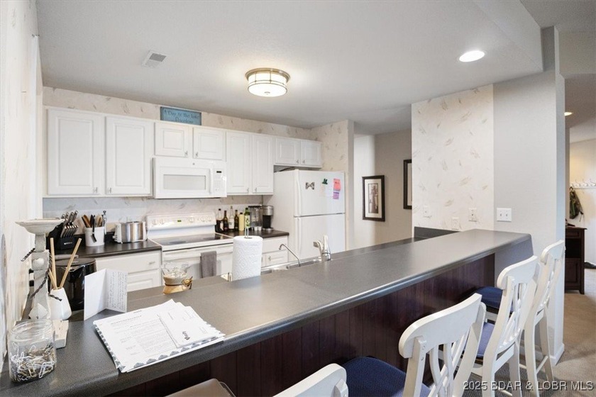 Walk-in from the Parking Lot! End Unit! Turn-Key! Great views of - photo 9