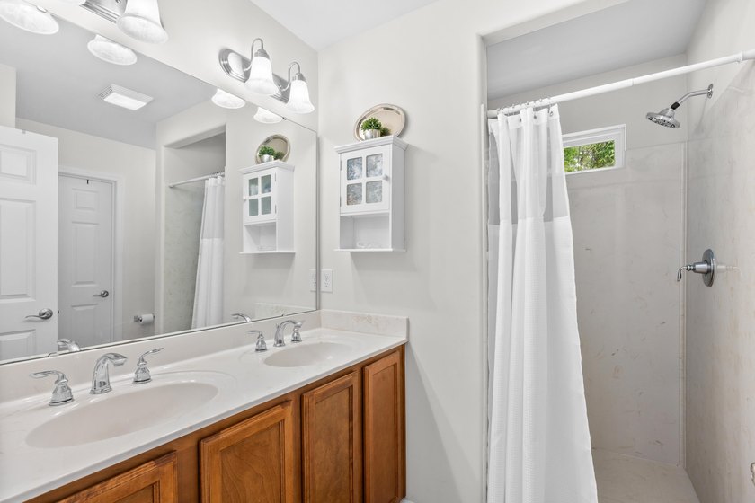 This 3 bed/2 bath charming coastal cottage is nestled within The - photo 22