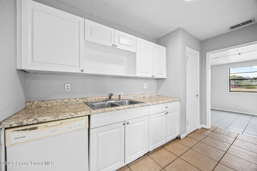 Discover this charming corner-lot home, freshly painted and - photo 7