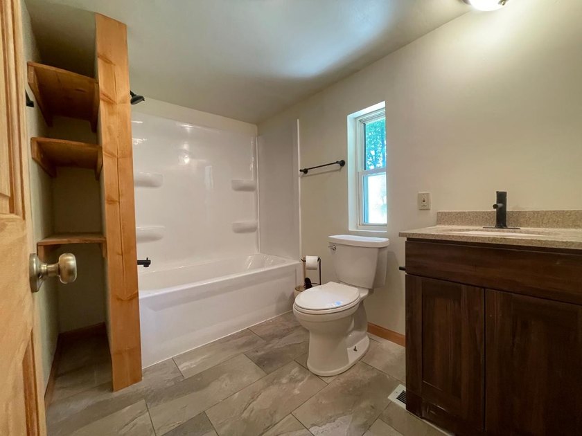 Newly remodeled and move-in ready, this inviting 3-bedroom - photo 15