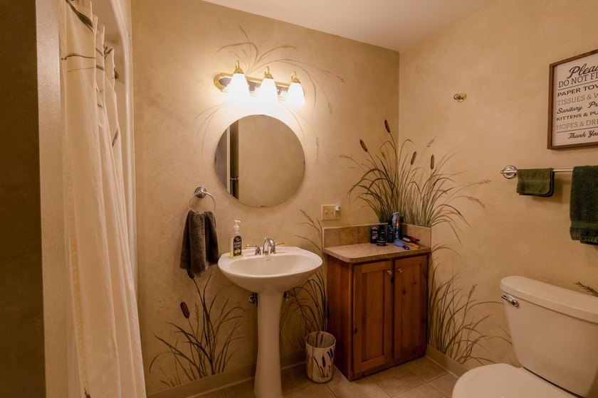 Neat, tidy, and designed for easy main-level living, this - photo 27