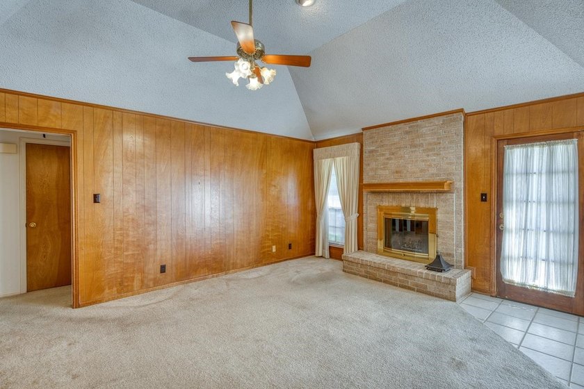 Opportunity awaits in this quaint brick home with a tile roof - photo 3