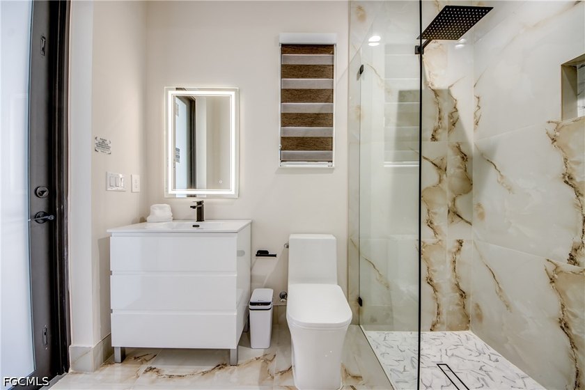 Discover modern coastal living in this new construction - photo 25