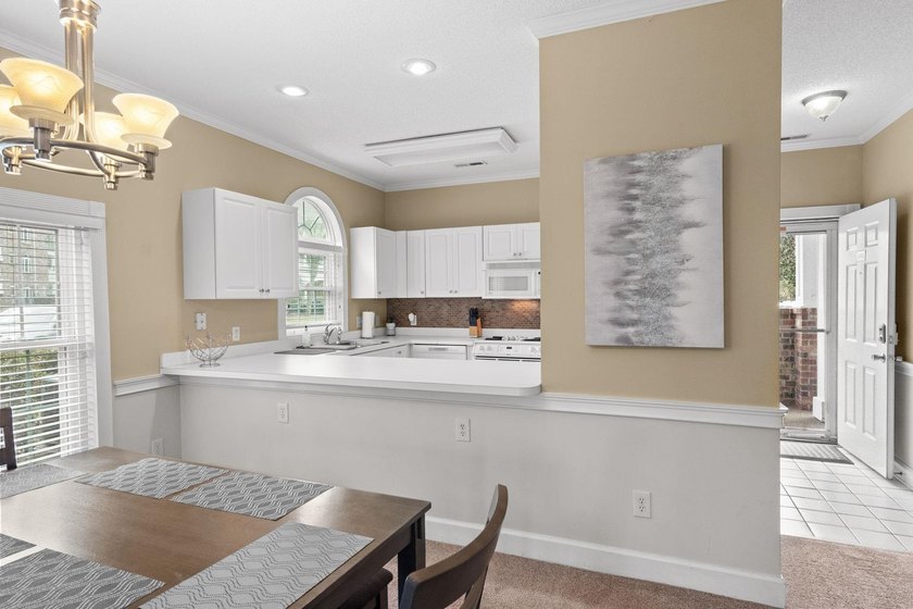 Welcome to 687 Riverwalk Dr, Unit 104, a coastal condo located - photo 12