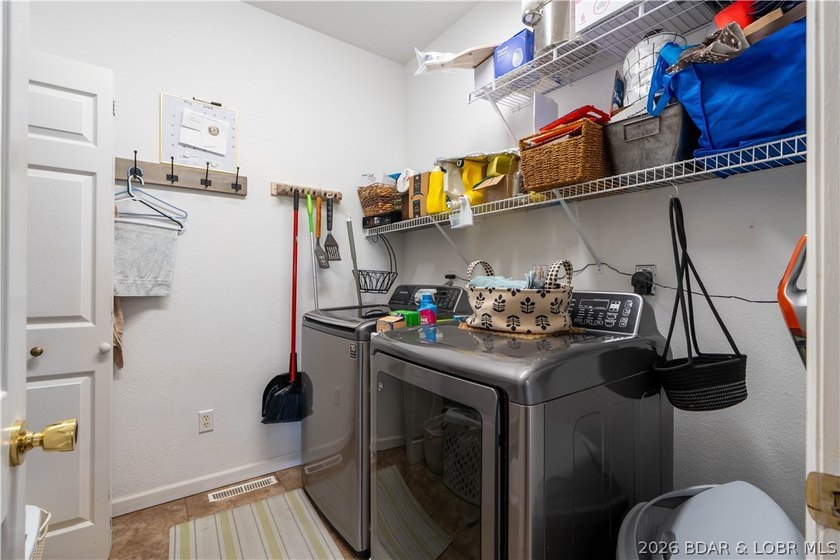 Walk-in, no steps, attached garage, lake views, and very low - photo 17