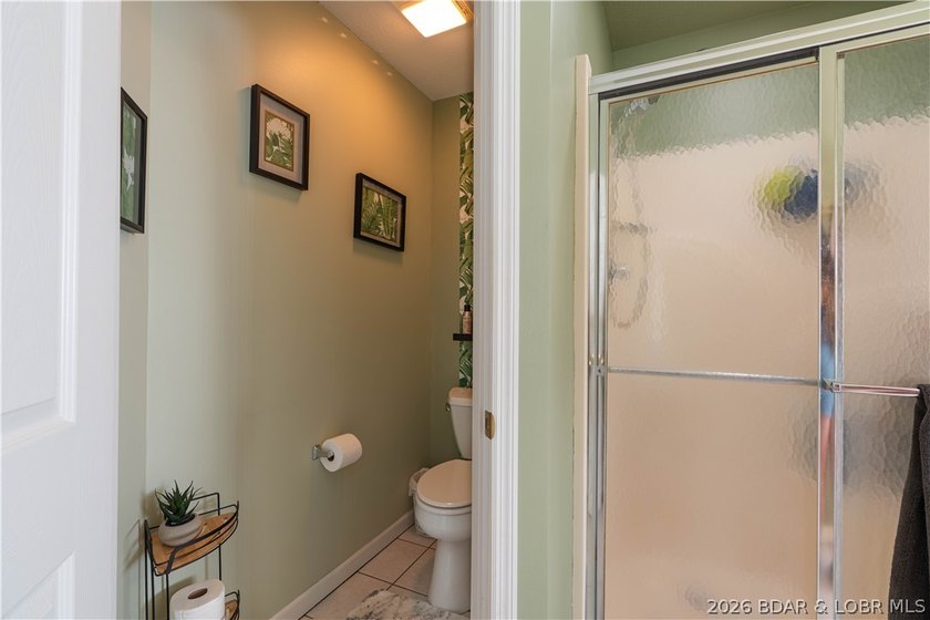 Walk-in, no steps, attached garage, lake views, and very low - photo 22