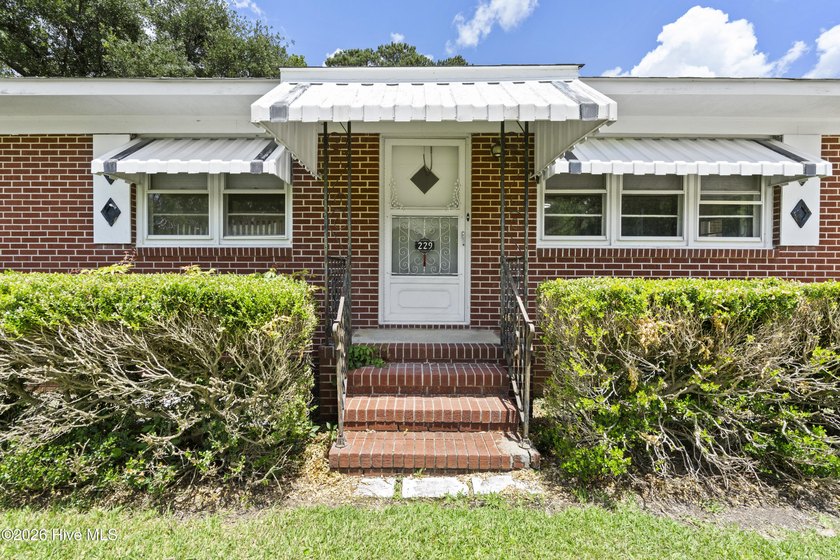Charming, well-maintained brick home situated on a rare .79-acre - photo 3