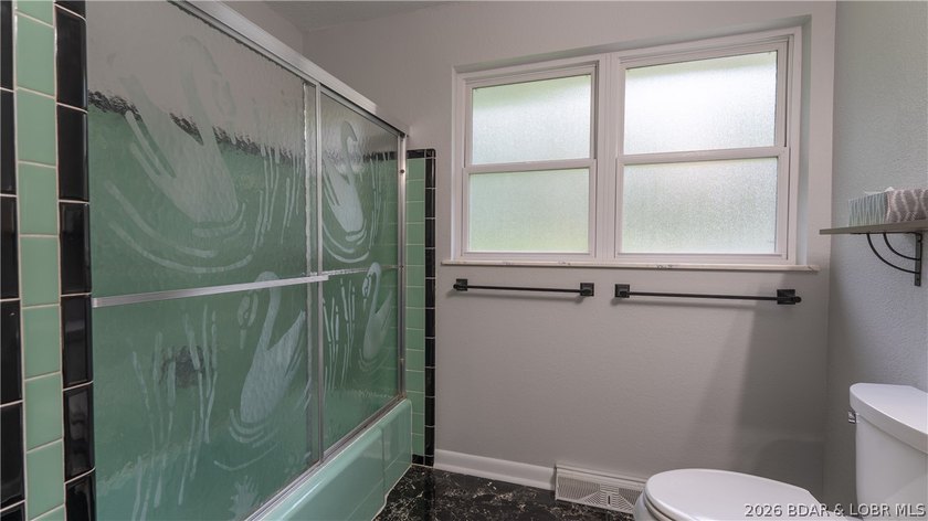 Lakefront living at its finest! This updated 4-bedroom, 3-bath - photo 19