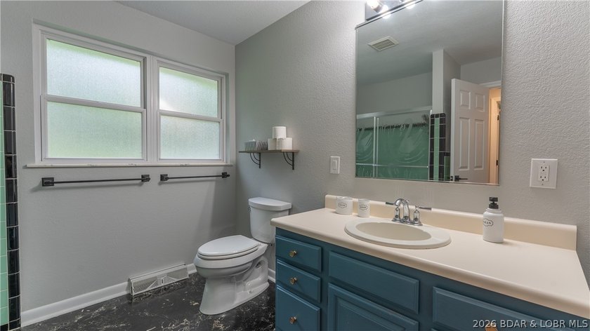 Lakefront living at its finest! This updated 4-bedroom, 3-bath - photo 20