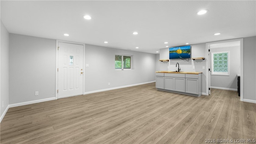 Lakefront living at its finest! This updated 4-bedroom, 3-bath - photo 26
