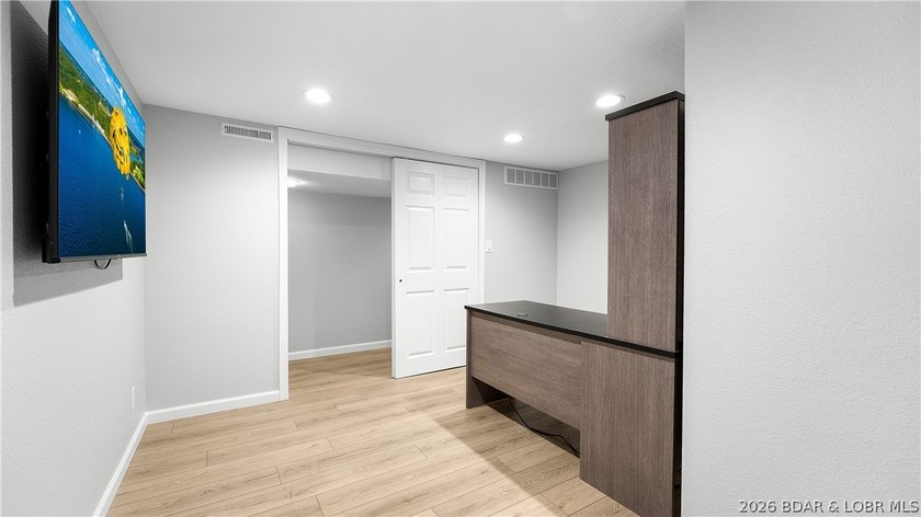 Lakefront living at its finest! This updated 4-bedroom, 3-bath - photo 31