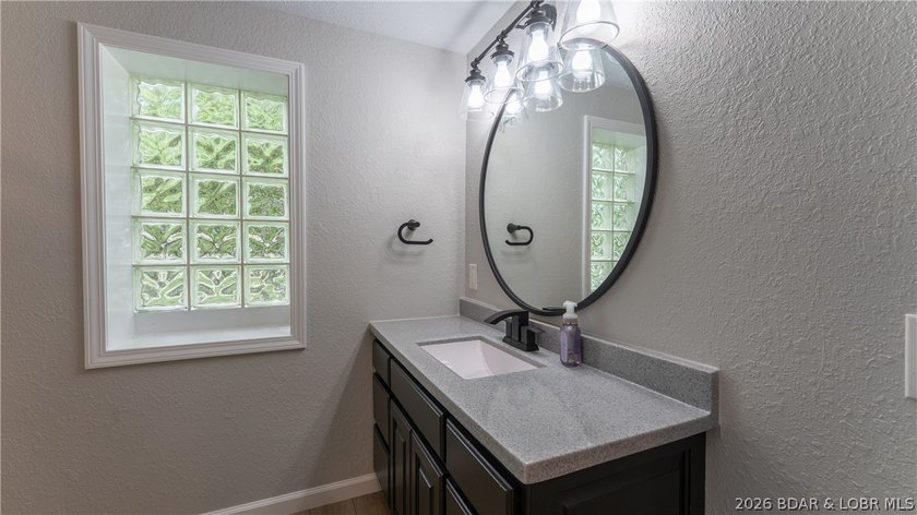 Lakefront living at its finest! This updated 4-bedroom, 3-bath - photo 34