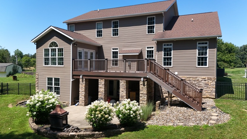 Welcome to this stunning two-story waterfront home in the highly - photo 4