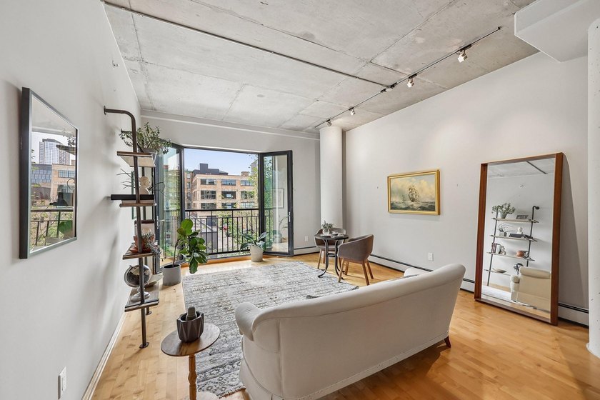 Welcome to 212 Lofts, where city living feels open, bright, and - photo 3