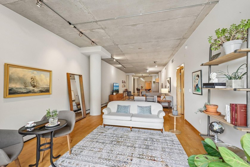 Welcome to 212 Lofts, where city living feels open, bright, and - photo 6