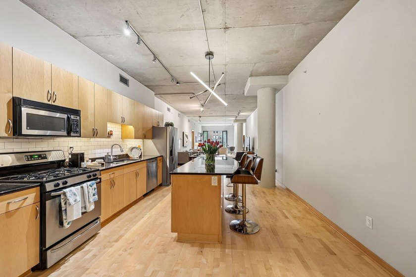 Welcome to 212 Lofts, where city living feels open, bright, and - photo 10