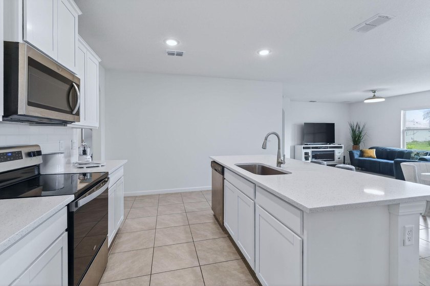 Built in 2023, this meticulously maintained 4/2 CBS home offers - photo 11