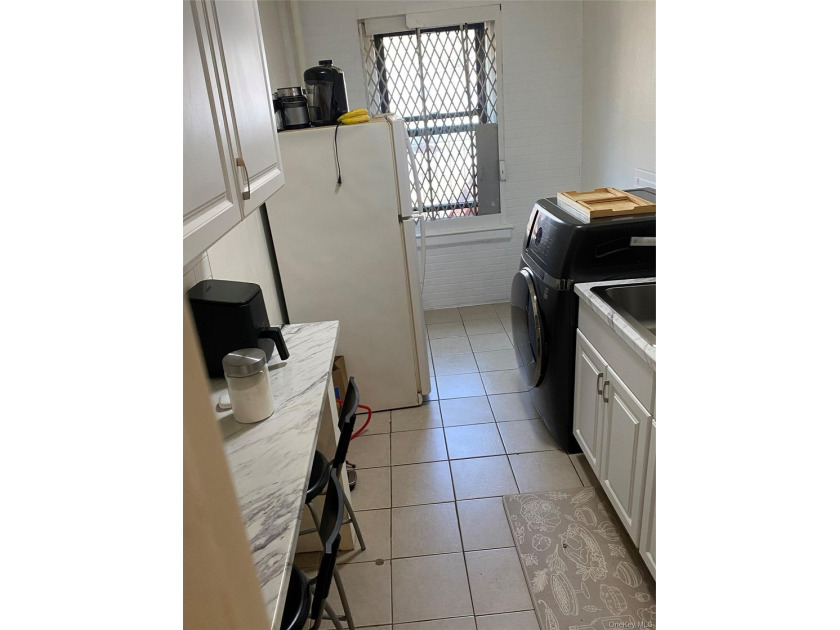 Renovated 1-bedroom, 1-bath co-op featuring a bright living and - photo 4