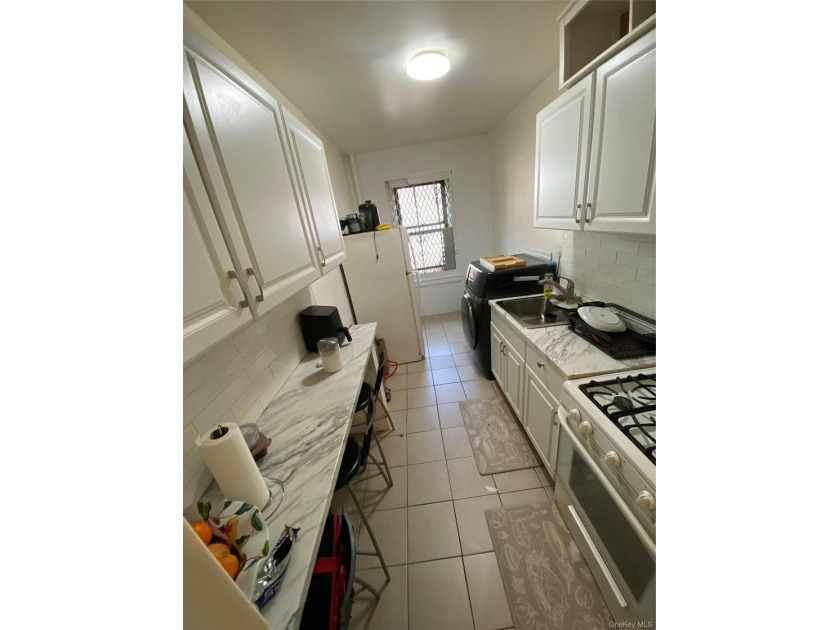 Renovated 1-bedroom, 1-bath co-op featuring a bright living and - photo 5