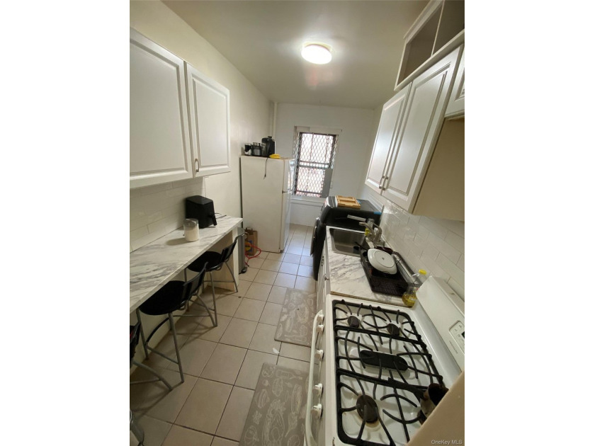 Renovated 1-bedroom, 1-bath co-op featuring a bright living and - photo 7