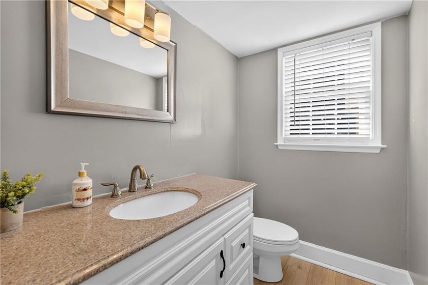 Tucked into a private wooded lot with a stunning lake view in - photo 30