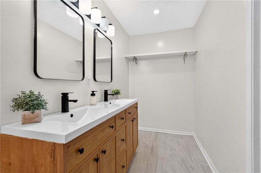 Tucked into a private wooded lot with a stunning lake view in - photo 36