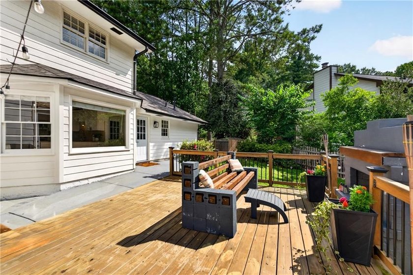 Tucked into a private wooded lot with a stunning lake view in - photo 46