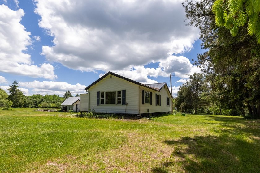 Set on nearly 25 acres along the scenic Deerskin River in Phelps - photo 11