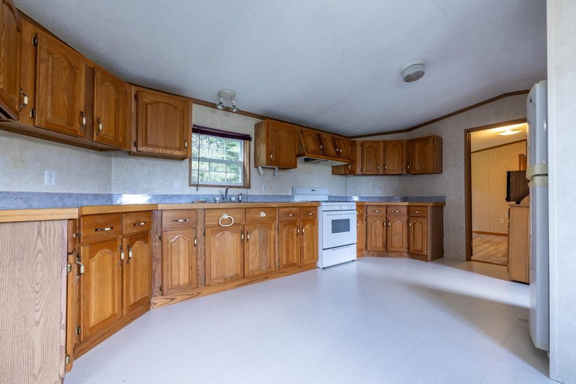 Set on nearly 25 acres along the scenic Deerskin River in Phelps - photo 13