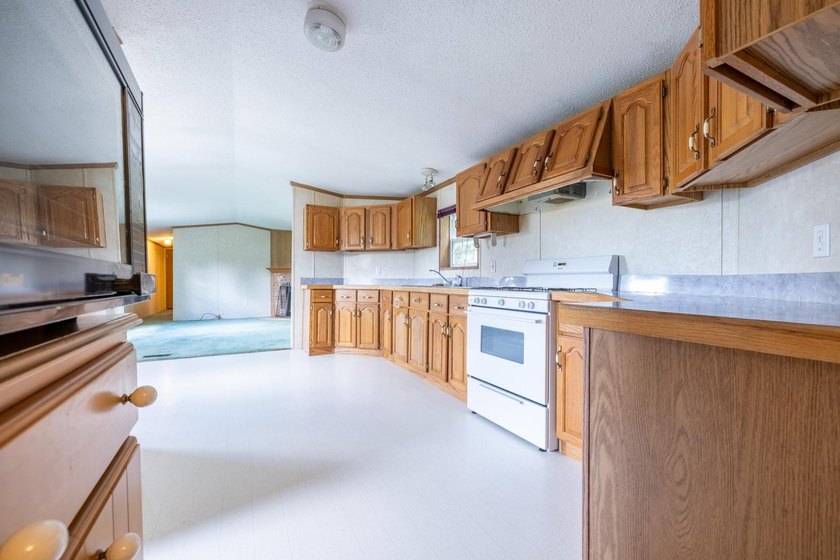 Set on nearly 25 acres along the scenic Deerskin River in Phelps - photo 14
