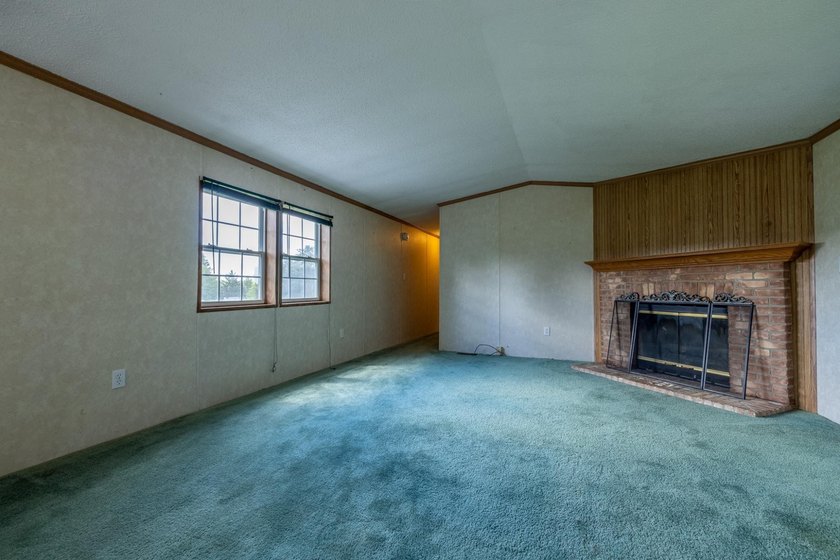 Set on nearly 25 acres along the scenic Deerskin River in Phelps - photo 15