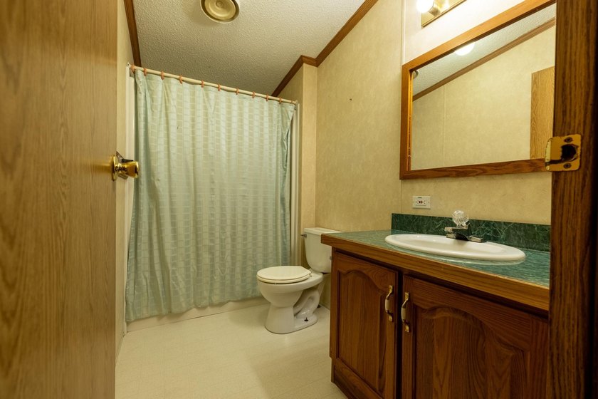 Set on nearly 25 acres along the scenic Deerskin River in Phelps - photo 17