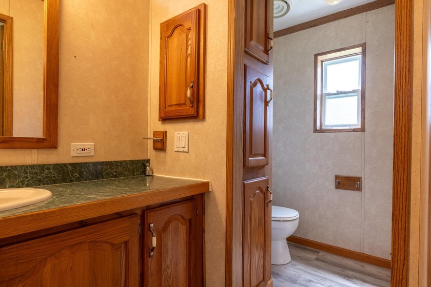 Set on nearly 25 acres along the scenic Deerskin River in Phelps - photo 18