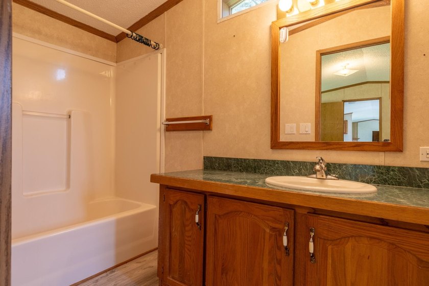 Set on nearly 25 acres along the scenic Deerskin River in Phelps - photo 20
