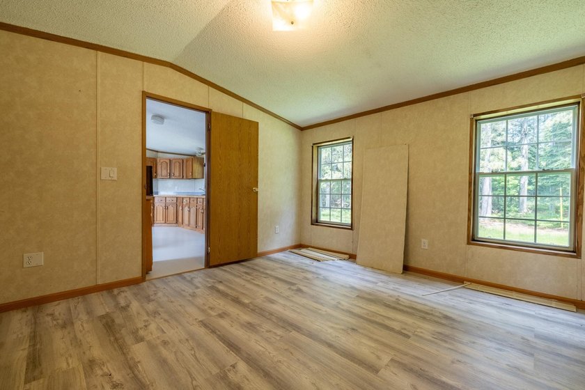 Set on nearly 25 acres along the scenic Deerskin River in Phelps - photo 21